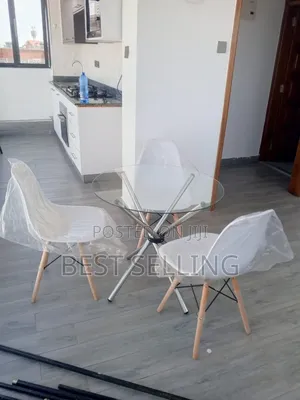 Clear Coffee Table and Eames Chairs