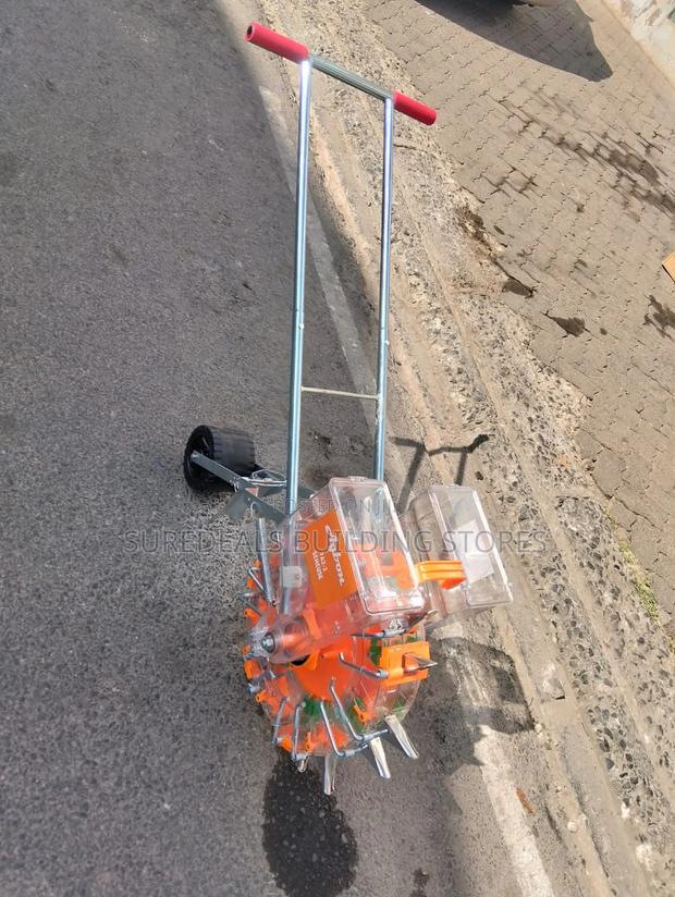 Manual Hand-push Seed And Fertilizer Planter. - main view