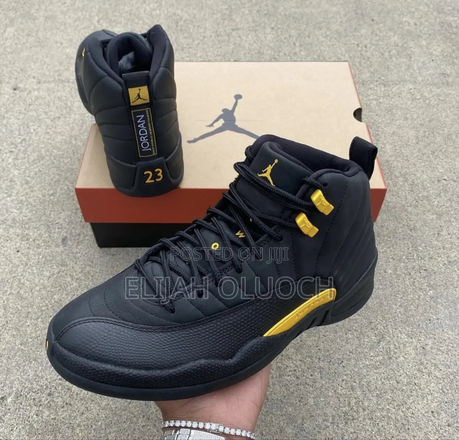 Nike Air Jordan 12 Retro "Black Taxi" Sneakers.