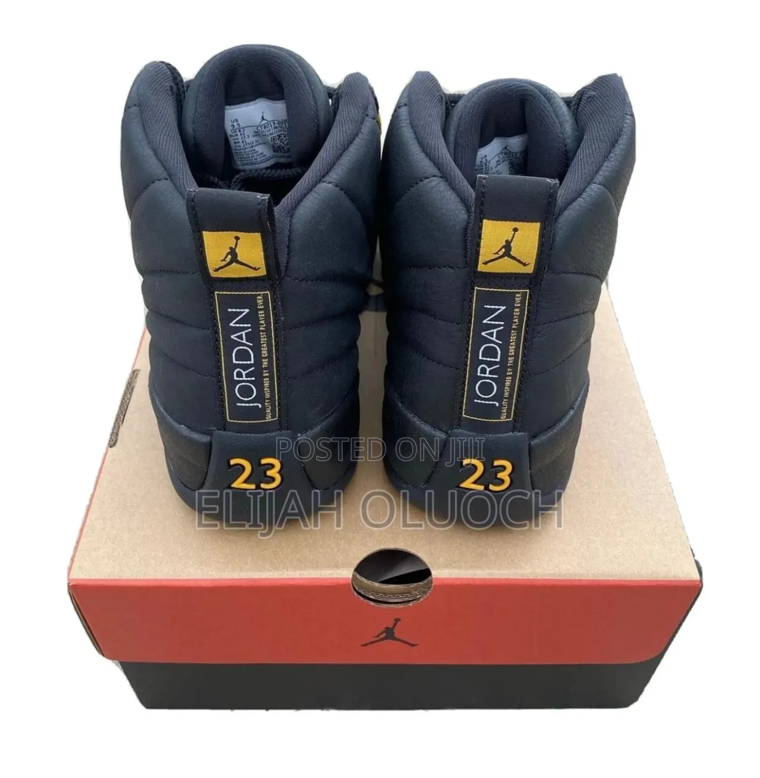 Nike Air Jordan 12 Retro "Black Taxi" Sneakers.