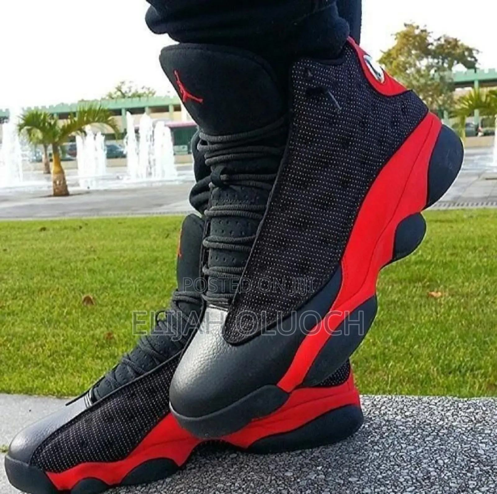 Air Jordan 13 Retro "Bred" Sneakers.