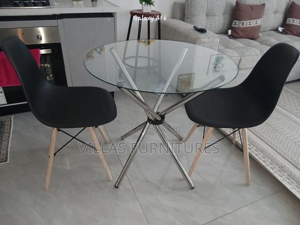 Plastic Eames Chair and Round Dining Table