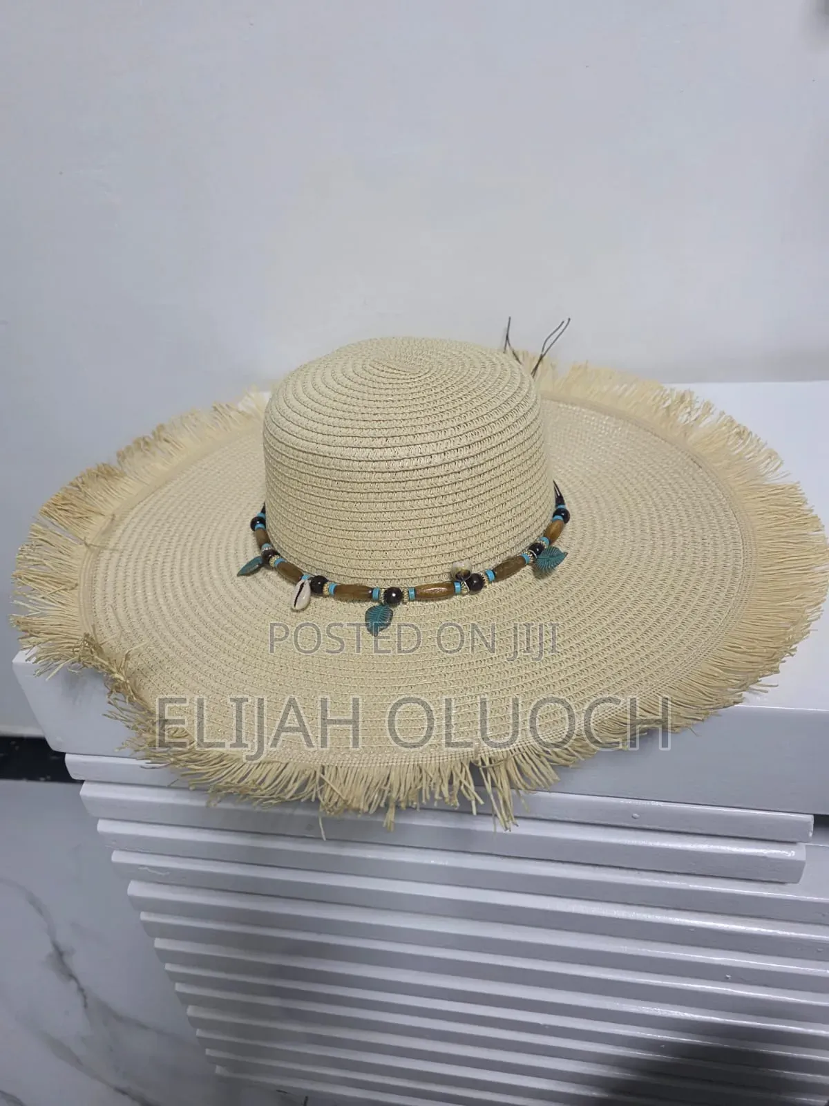 Straw Sun Hat Is Styled With A Beaded Hatband