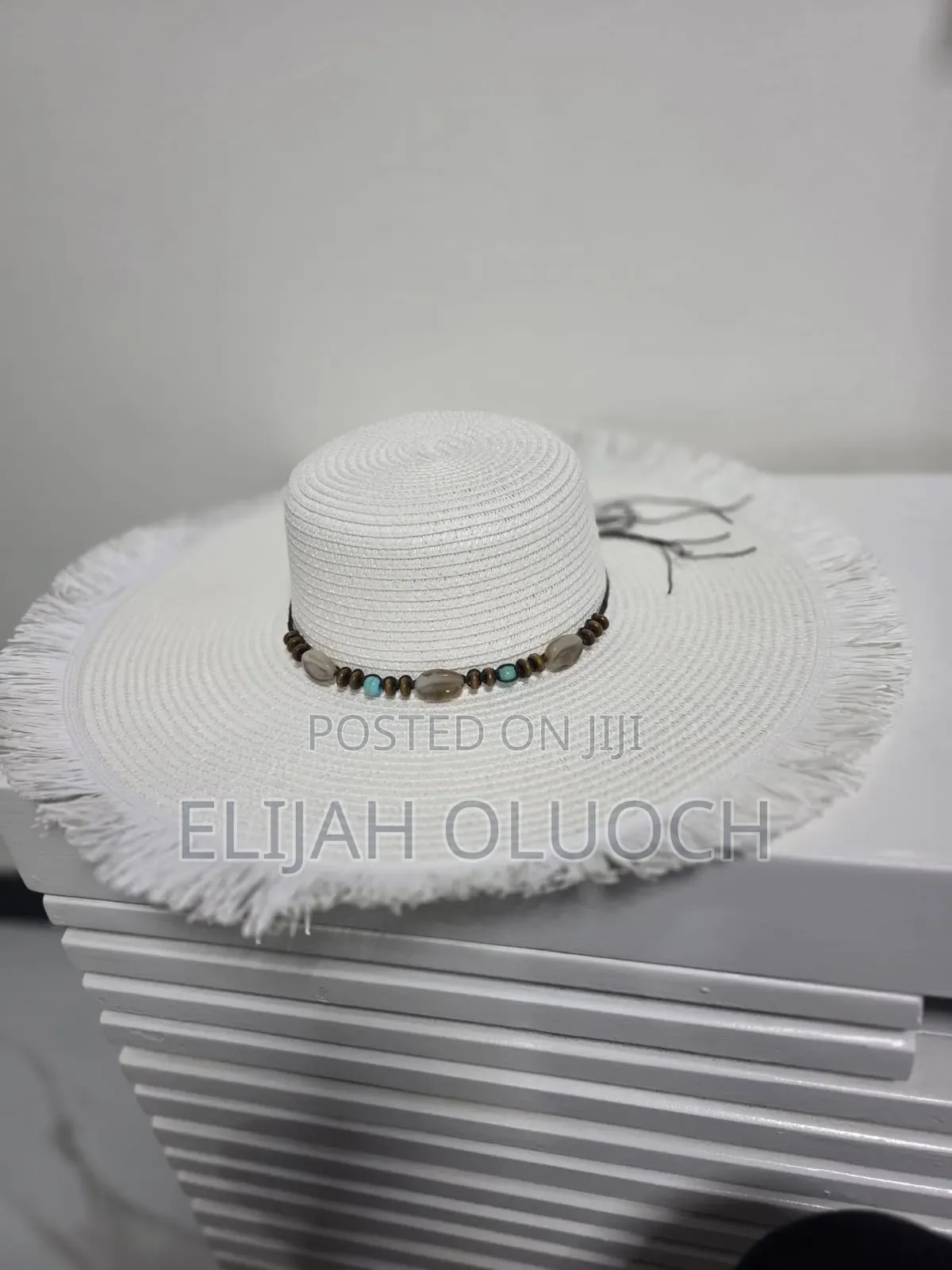 Straw Sun Hat Is Styled With A Beaded Hatband