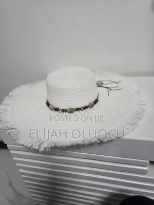 Straw Sun Hat Is Styled With A Beaded Hatband