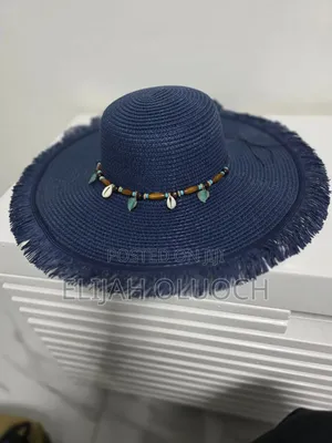 Straw Sun Hat Is Styled With A Beaded Hatband