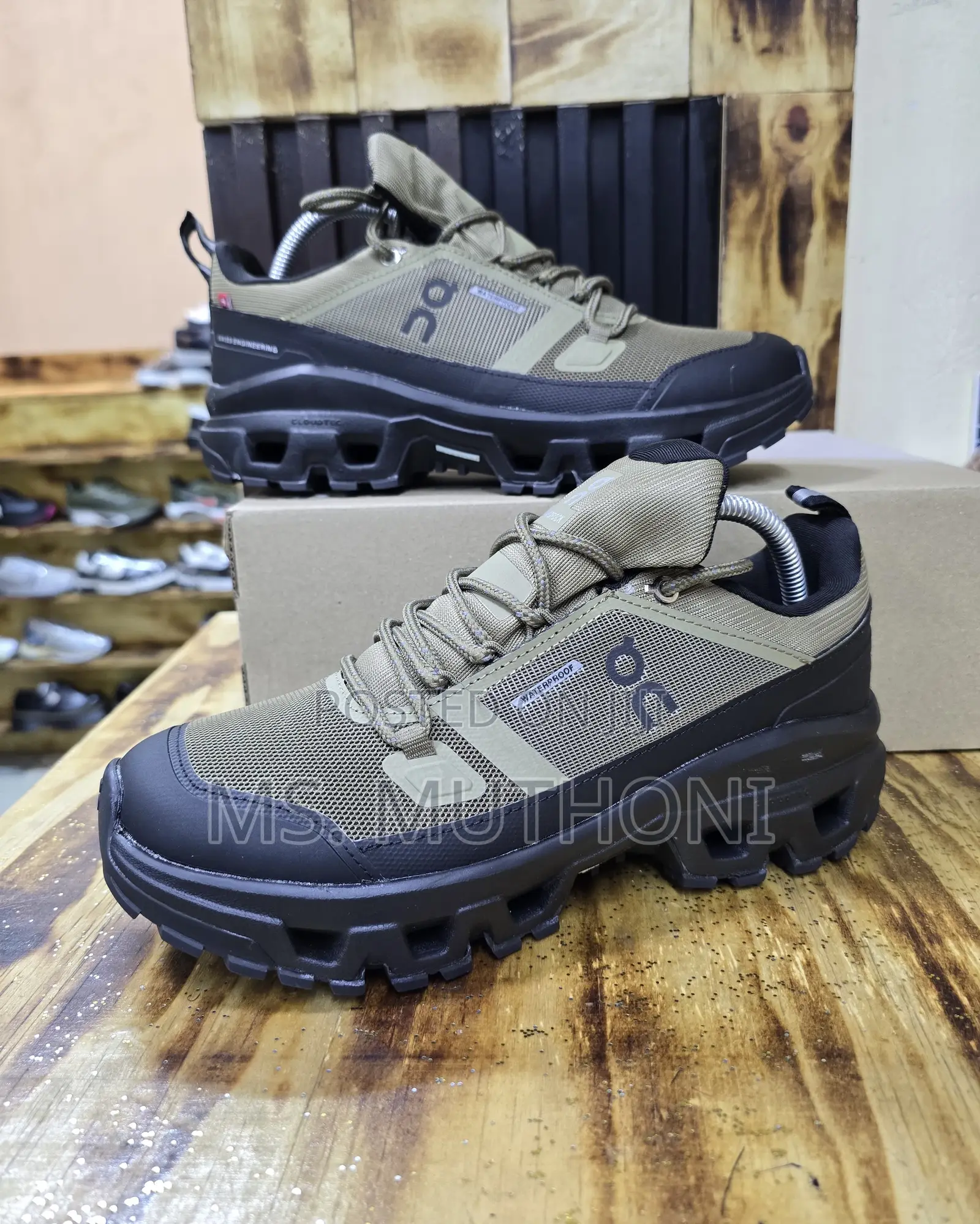 On Cloudrock Low Waterproof Hiking Shoe in the Hunter/Black Colorway