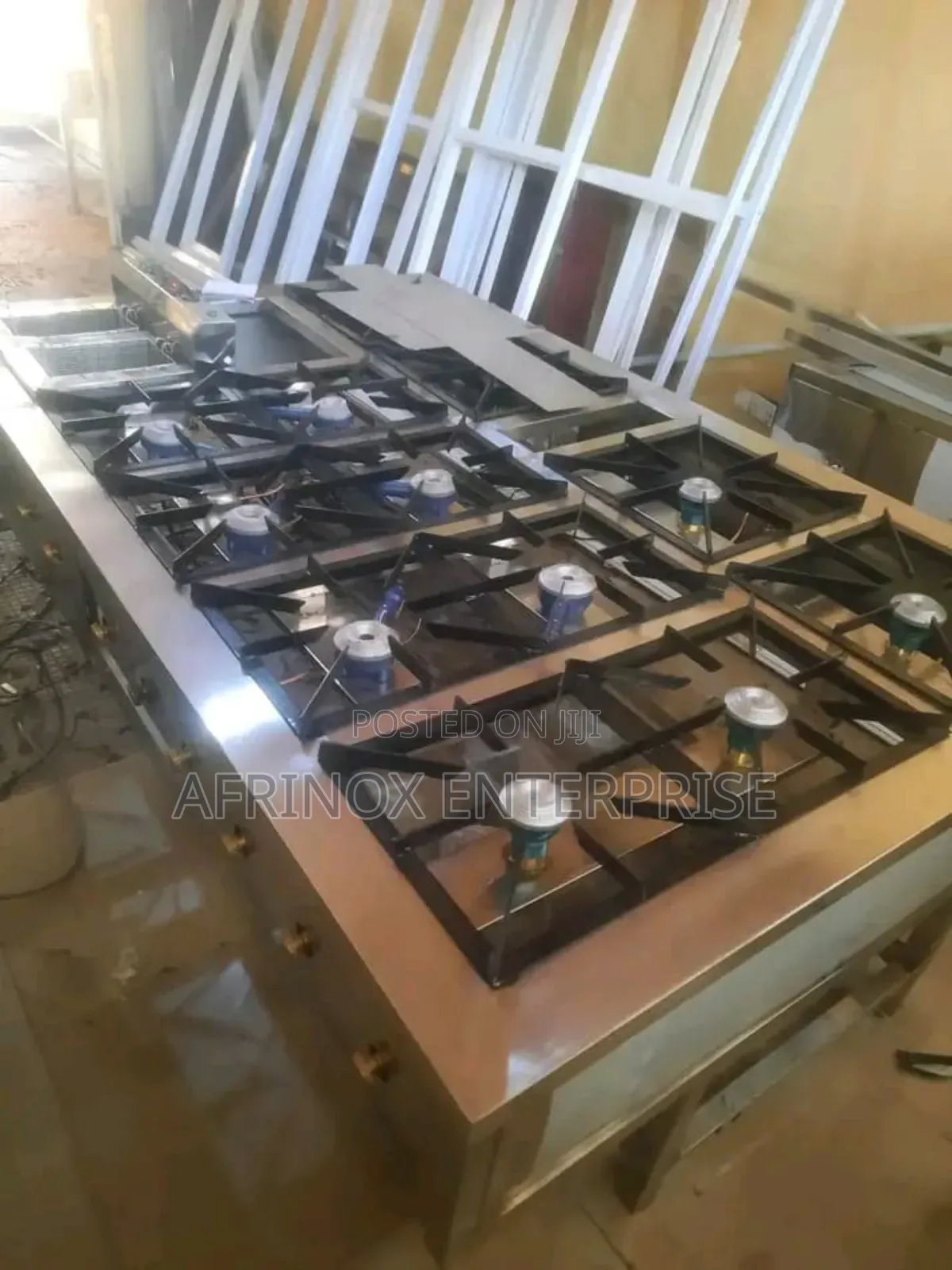 12 Burners Commercial Gas Cooker With a Deep Fryer Machine.