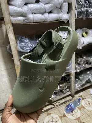 Nike Calm Mules and Slides