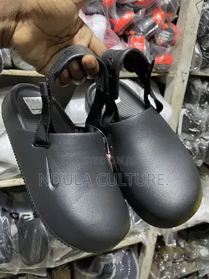 Nike Calm Mules and Slides