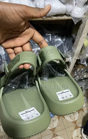 Nike Calm Mules and Slides
