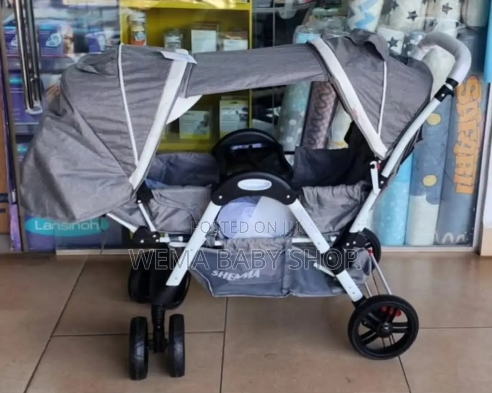 Tandem Twin Baby Stroller or Pushchair in Gray.