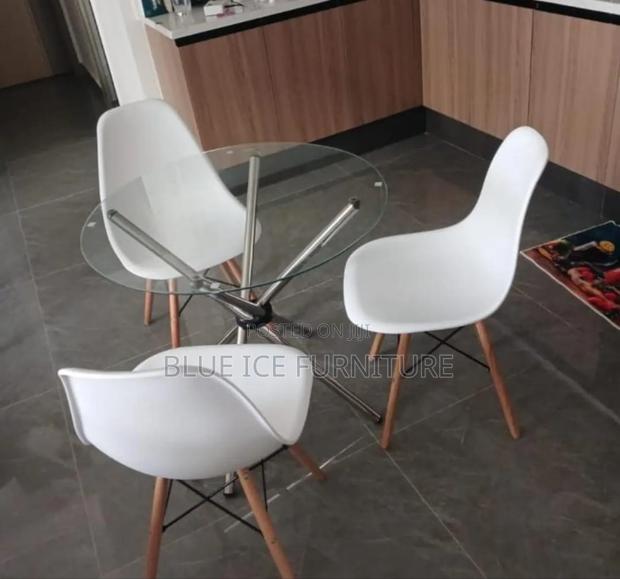Glass Table With White Eames Chair