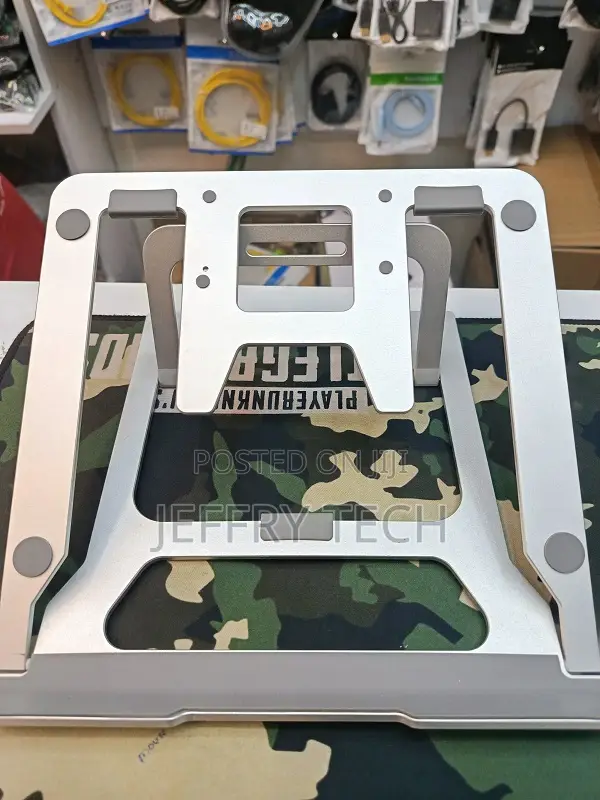 Adjustable Foldable Aluminum Stand Designed for Laptops and Tablets.