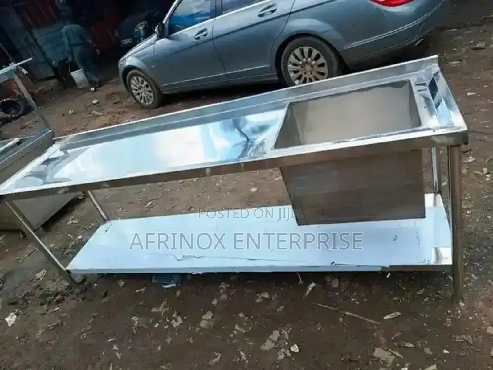 Stainless Steel Work Table With an Integrated Sink.