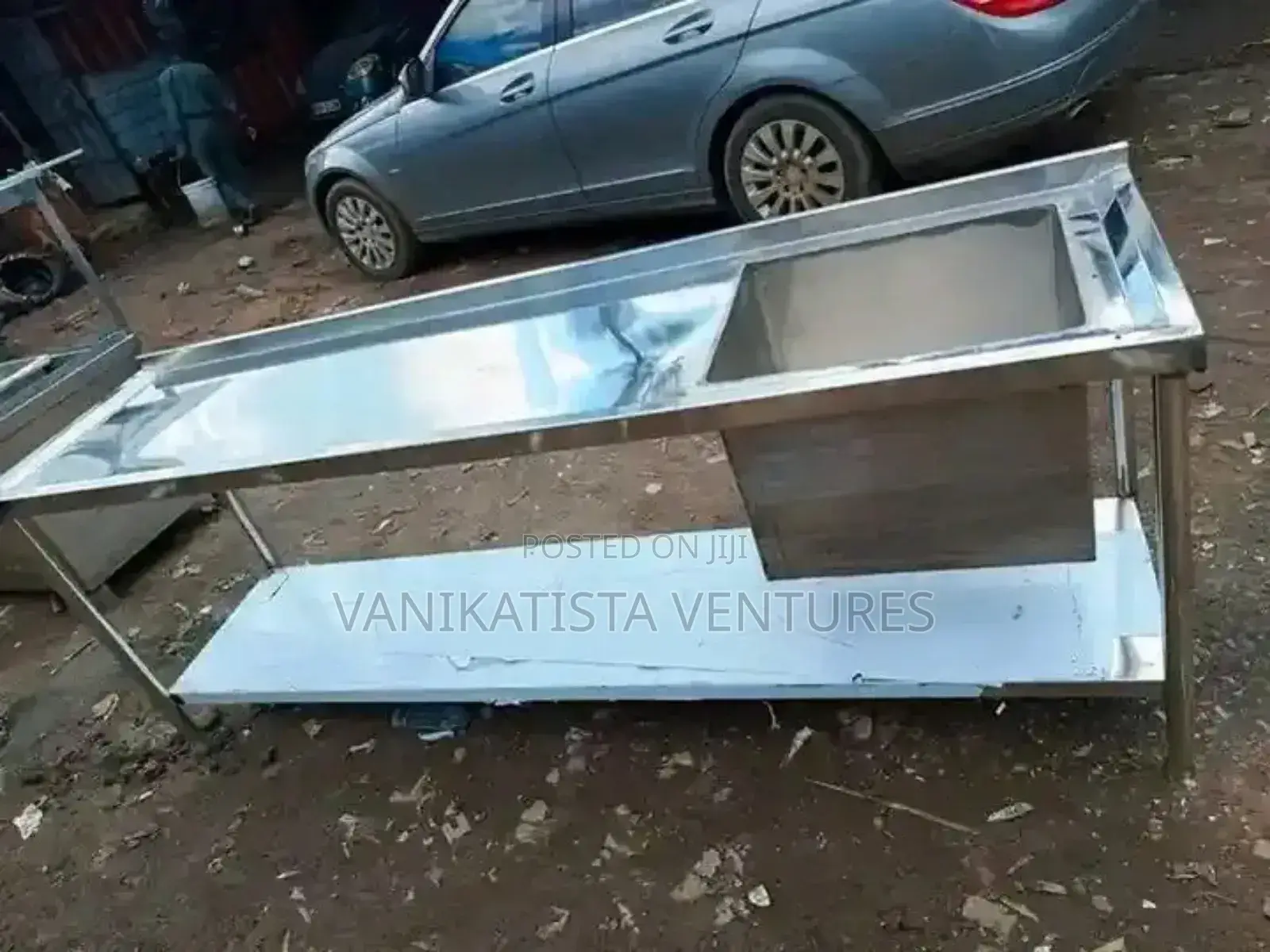 Stainless Steel Work Table With an Integrated Sink.