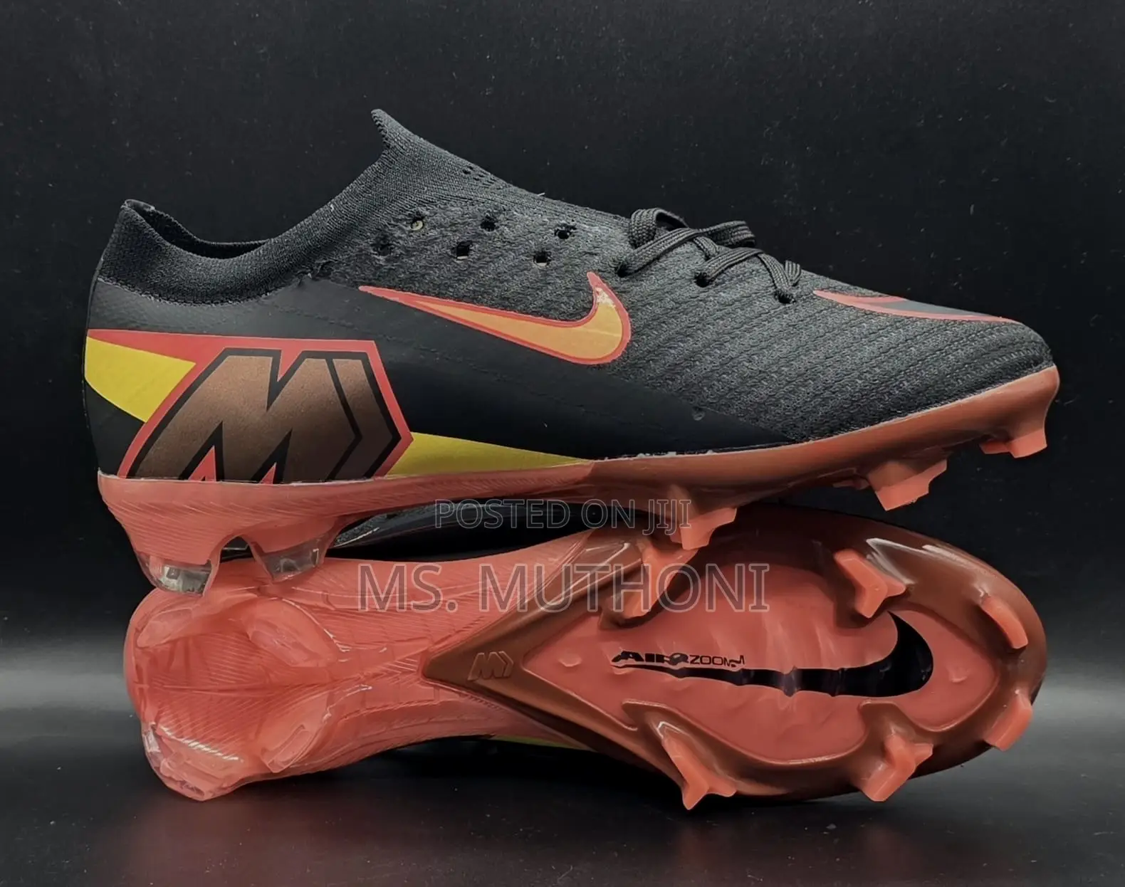 Nike Mercurial Vapor 12 Elite Soccer Cleats in a Black and Orange