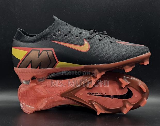 Nike Mercurial Vapor 12 Elite Soccer Cleats in a Black and Orange