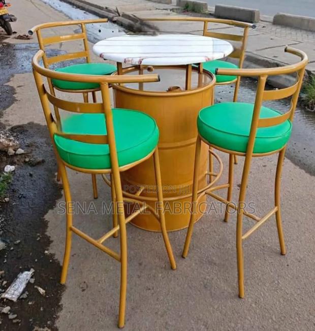 Drum Set With Green Bar Stools.