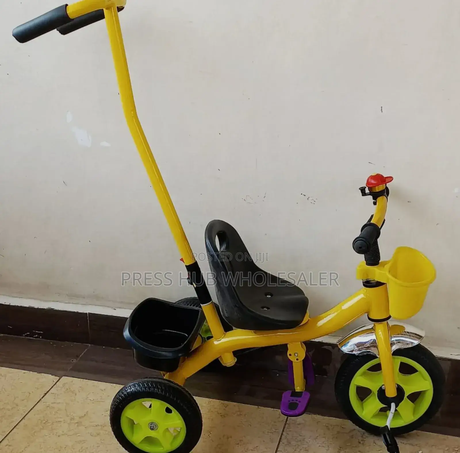 Tricycle With a Push Handle. ; 