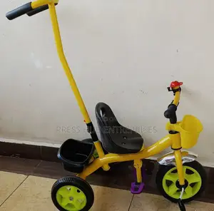 Tricycle With a Push Handle. ; 