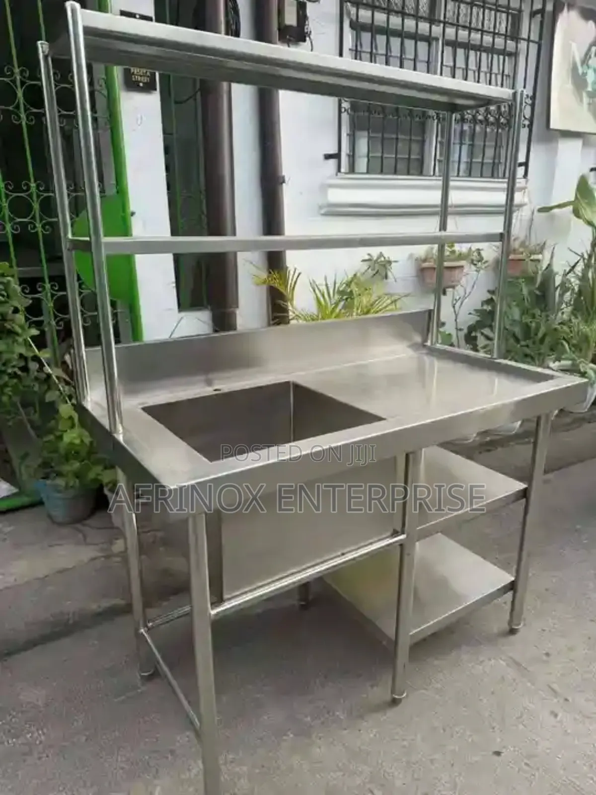 Stainless Steel Work Table With an Integrated Sink,