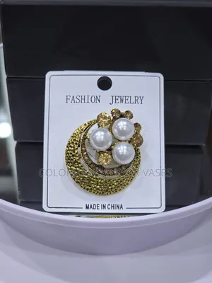 Variety of Gold Rusty Brooches