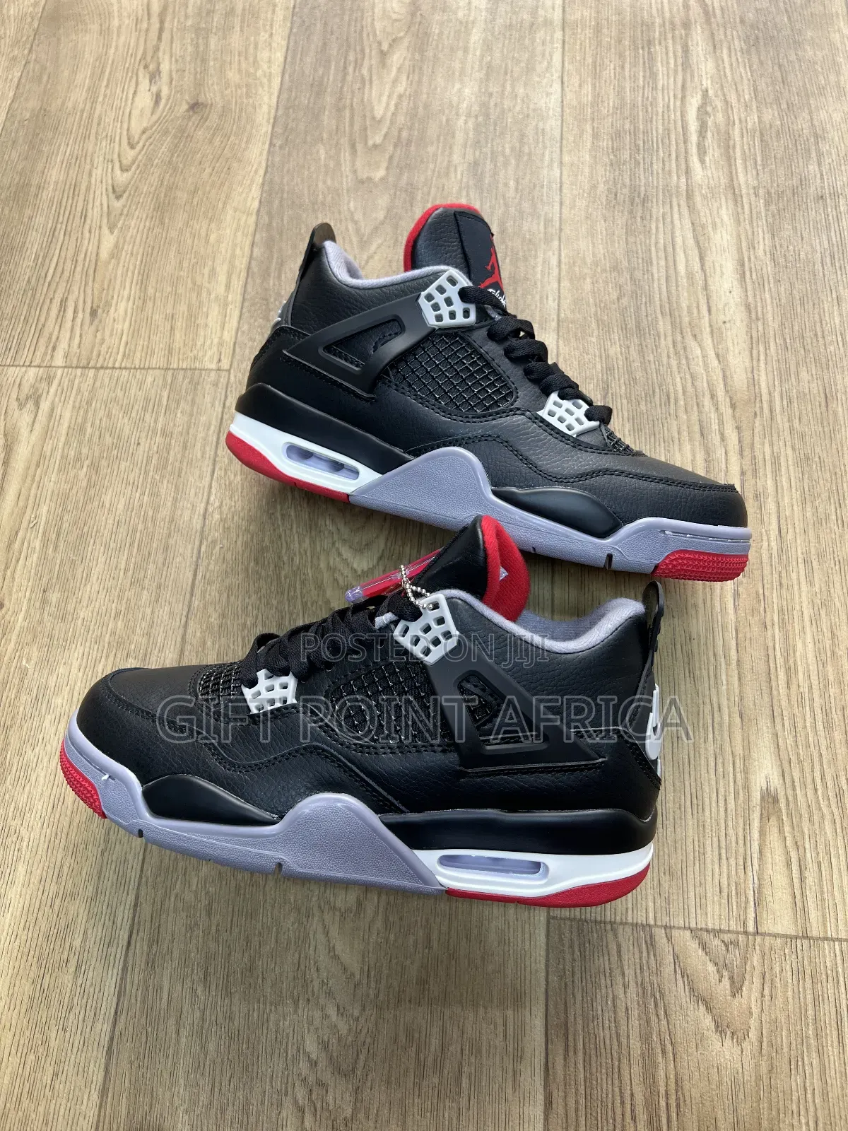 Nike Air Jordan 4 Retro Bred Reimagined Sneakers.