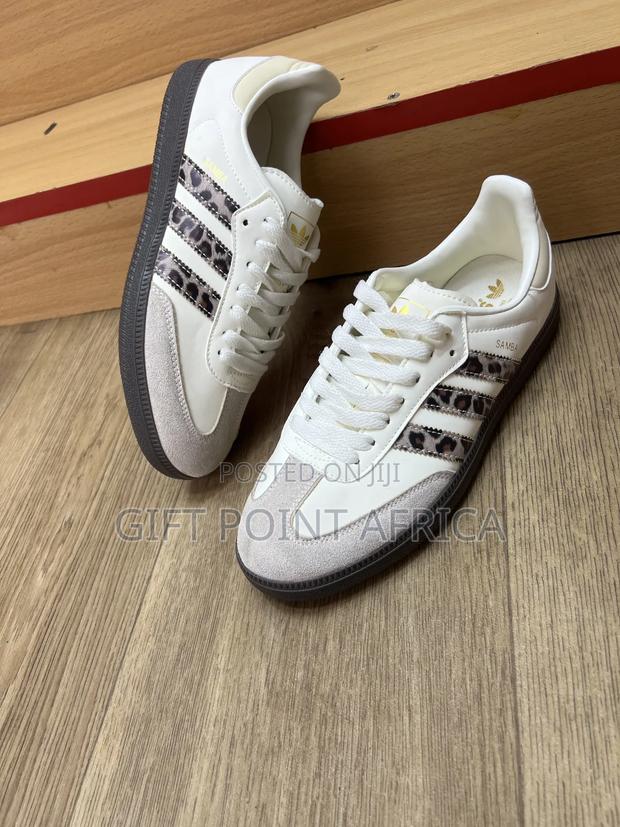 Adidas Originals Samba Og In A White And Leopard Print Colorway.