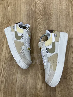 Nike Air Force 1 Low "Tan Bling" Model.