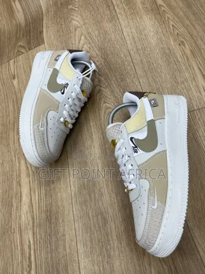 Nike Air Force 1 Low "Tan Bling" Model.