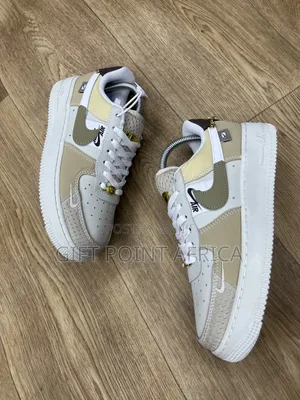 Nike Air Force 1 Low "Tan Bling" Model.