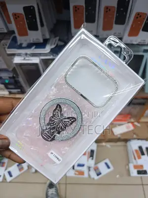 iPhone 17 Pro, a Decorative Ring Stand With a Butterfly Design.