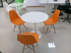 White Coffee Dining Table With Orange Eame Chair