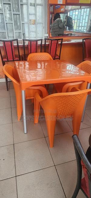 Four Plastic Chairs With a Square Plastic Table Set - main view
