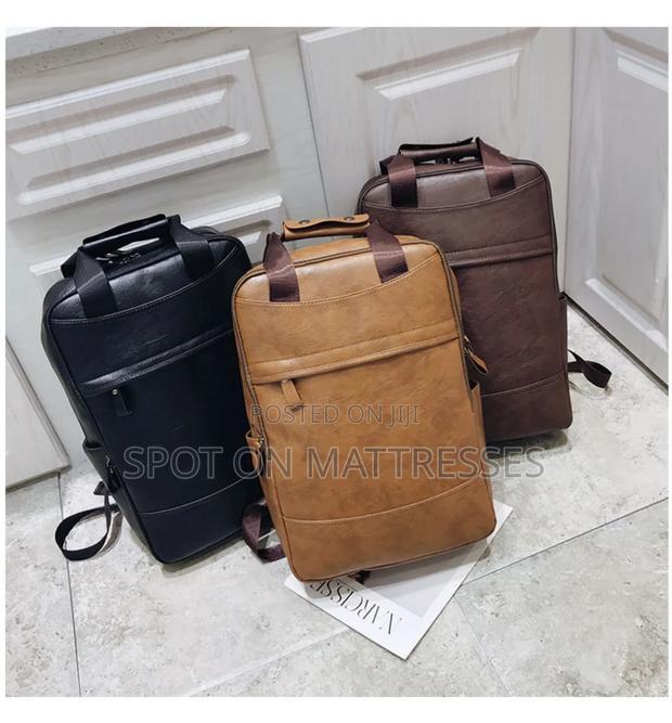 Classic Unisex Backpack. Brown And Black. Delivery Services Available.