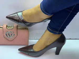 Pointed-Toe Heels Feature a Textured Finish on the Heel and Toe Cap