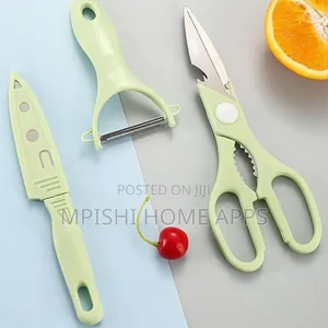 4-Piece Kitchen Set, a Knife, Peeler, Scissors, and a Cutting Board.