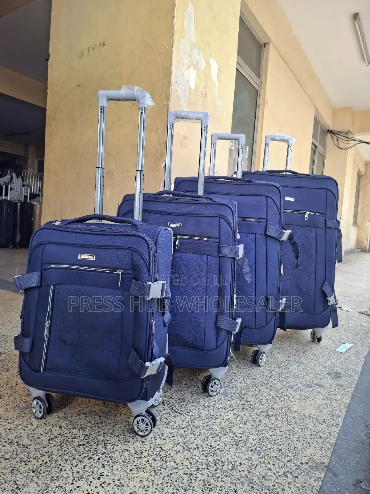 This Is a 4-in-1 Set of Blue Fabric Travel Suitcases