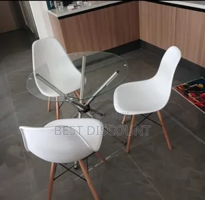 White Chairs and Glass Round Table