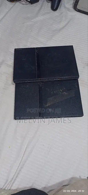 2 Playstation 2tm Consoles With 12 Games