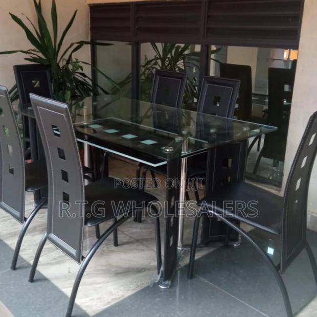 Modern 6‐Sitter Glass Top Dining Table With Leather Chairs