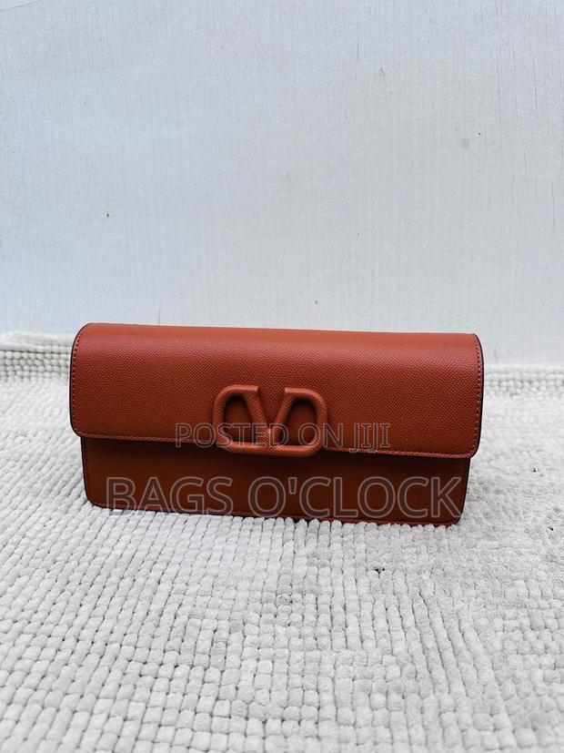 Authentic Valentino Garavani Brown Grained Leather Vlogo Clutch Bag