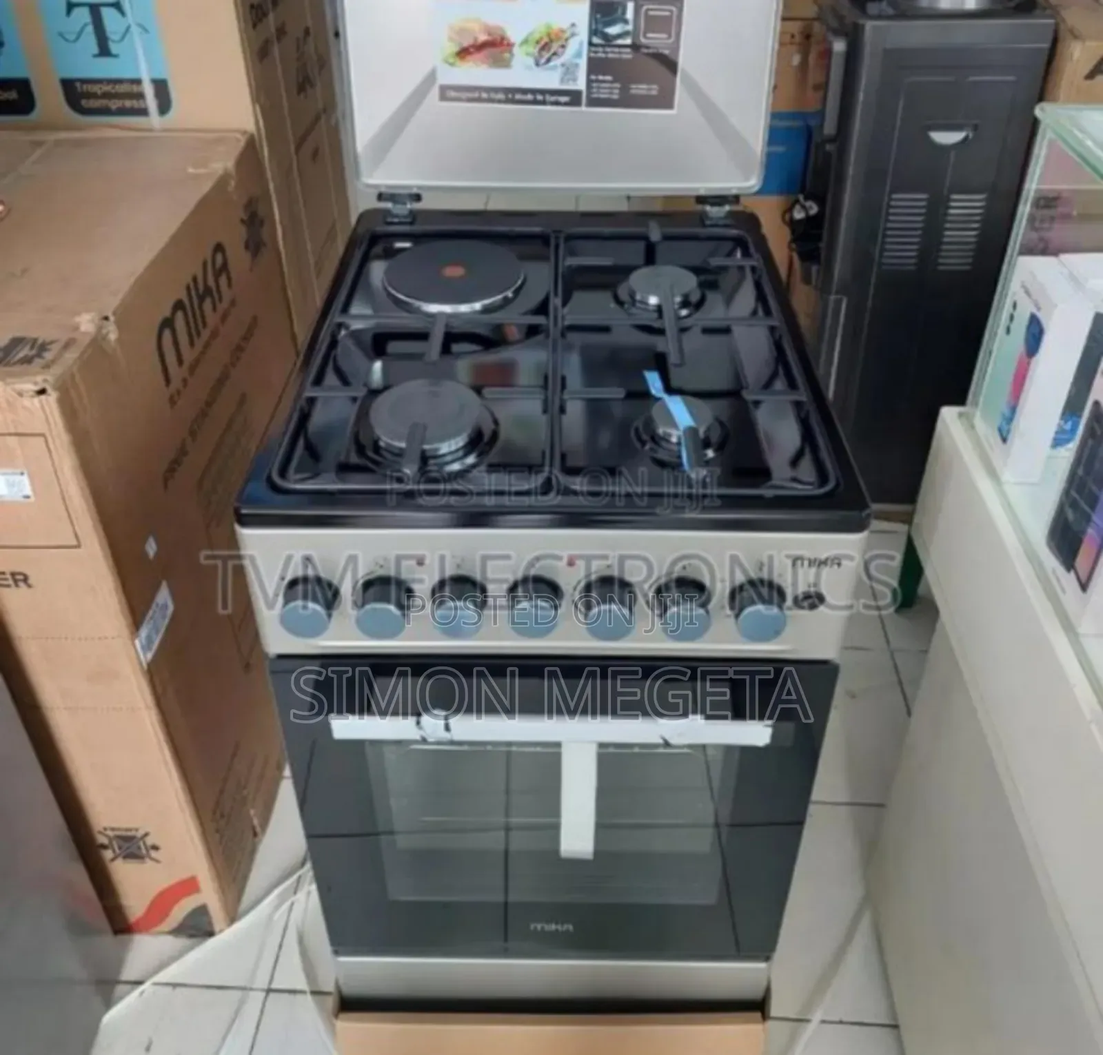 With Gas Oven. New Mika 50*60 Standing Cooker