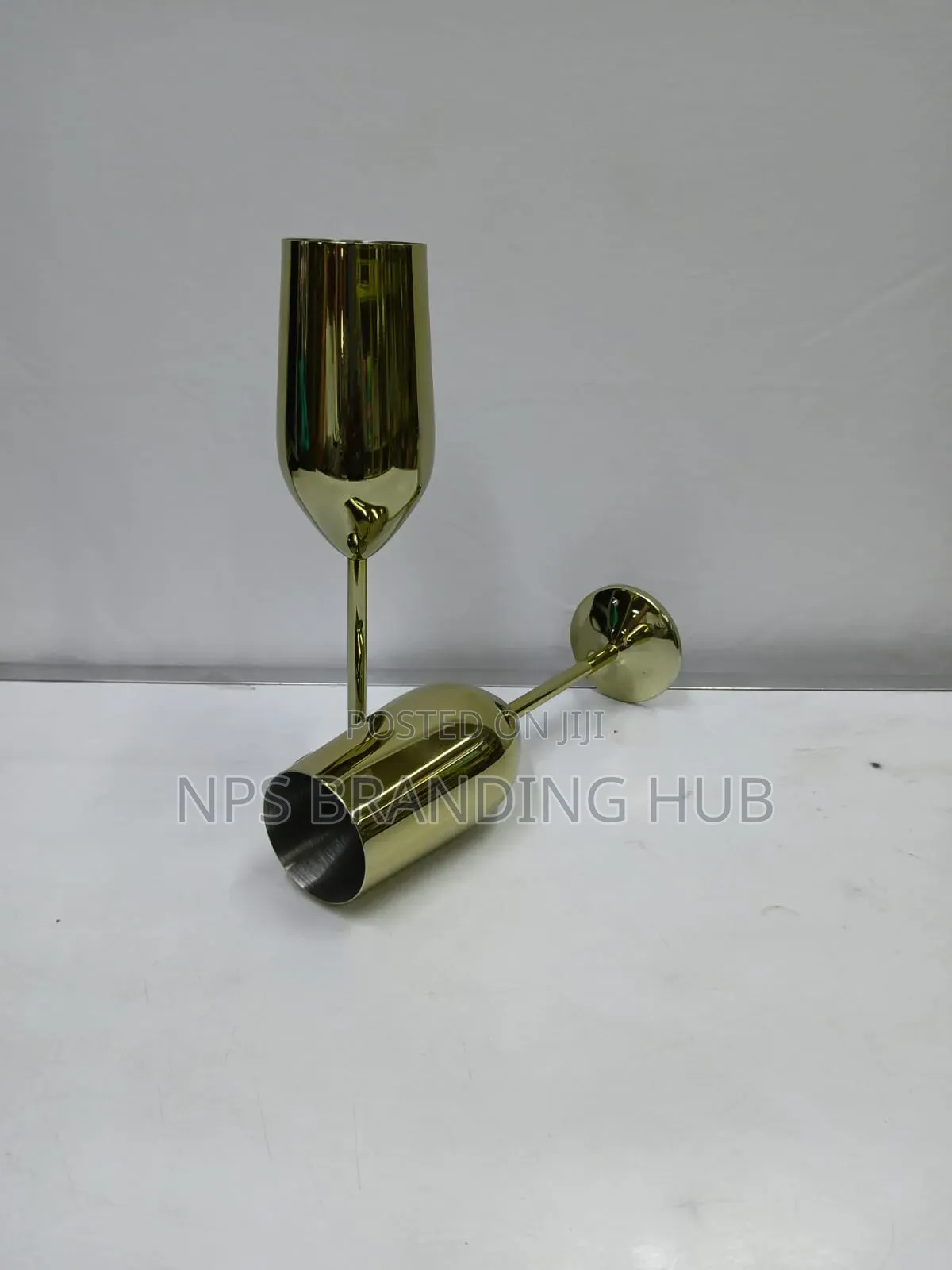 A Pair Of Gold Stainless Steel Wine Glass Eh