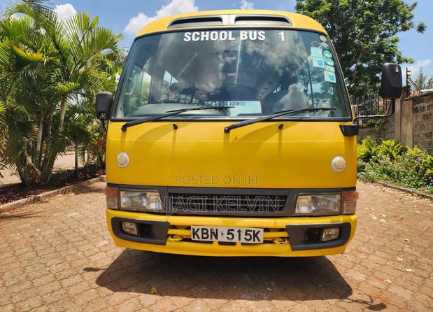 Toyota Coaster 2003 Yellow - main view