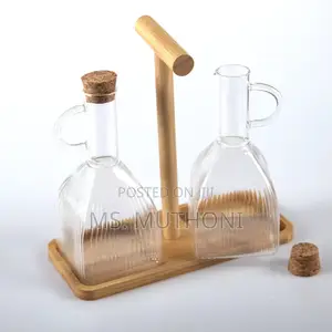Two PCS Glass Oil and Vinegar Cruets on a Bamboo Stand