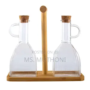 Two PCS Glass Oil and Vinegar Cruets on a Bamboo Stand