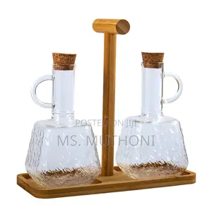 Two PCS Glass Oil and Vinegar Cruets on a Bamboo Stand