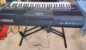 PSR Sx600 Yamaha Original Keyboard Complete With High-Quality Stand